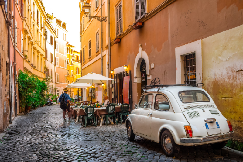 picture of old italian street with car parked