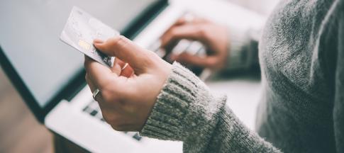 A woman buying something with a credit card