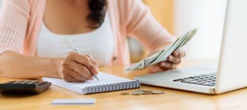 A woman budgeting at a table