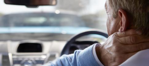 man-holding-his-neck-after-a-car-accident