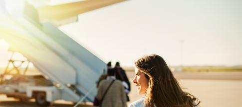 Woman boarding plane