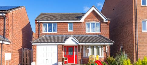 detached-house-with-red-door-and-garage