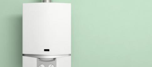 image of a modern white boiler on a green background