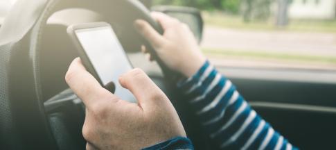 woman texting while driving