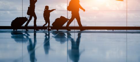 family walking through airport