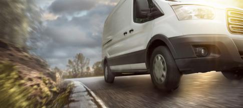 van driving down a country road