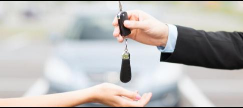 person-handing-over-a-car-key