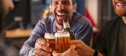 Image of a group of men enjoying a drink