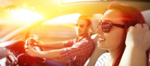 couple driving in the sun