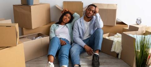 Image of a black couple experiencing house moving stress