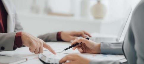 Image of two women sorting out a personal loan