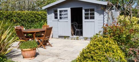 Shed with table and chairs outside