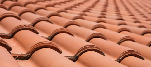 close up photo of red roof tiling 