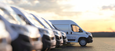 picture of row of vans in car park 