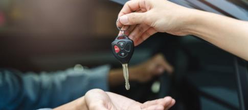 Passing a set of car keys into someone's hand