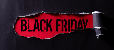 black friday sign showing under ripped paper