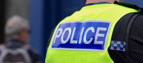 back of policeman in uniform 