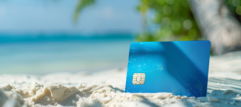 credit card standing in sand on beach