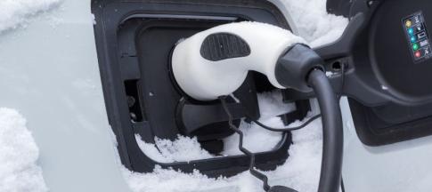 photo of EV charging port of snowy car