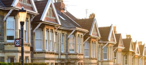 row of terraced houses at sunset