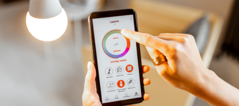 person using app to control smart bulb
