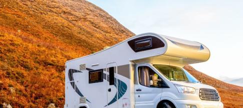 image of motorhome parked in field