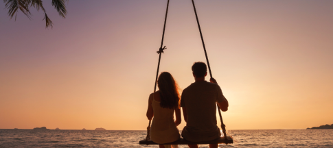 picture of a couple on a beach during sunset