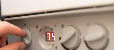 person changing boiler settings