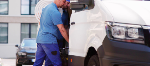 men loading a van