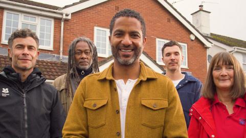 Flood Force team standing in front of home